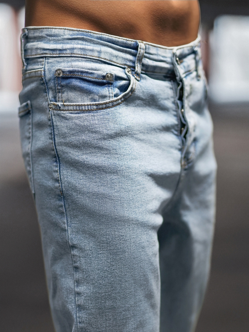 Spodnie jeansowe joggery męskie jasno-niebieskie OZONEE DP/780Z